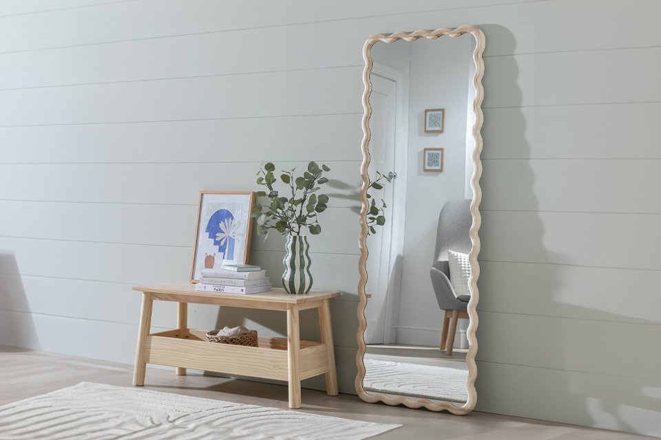 Habitat Solid Ash Full Length Wavy Wall Mirror placed against a wall.
